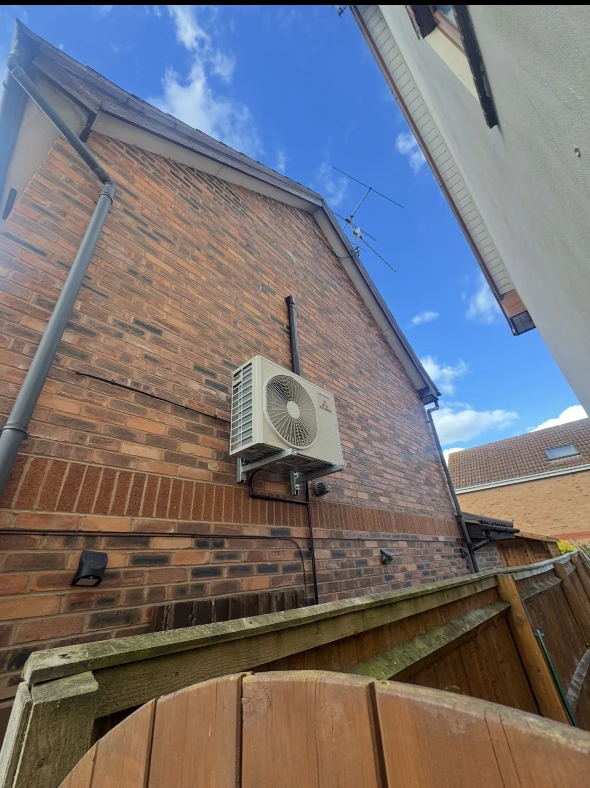 External air conditioning condenser unit installed on a Birmingham home by Aervue